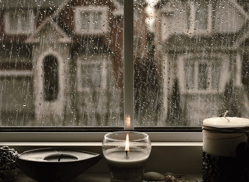 rainy day with a candle marks the setting