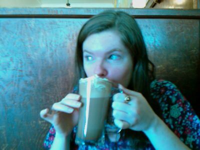 Karma Bennett drinking a latte
